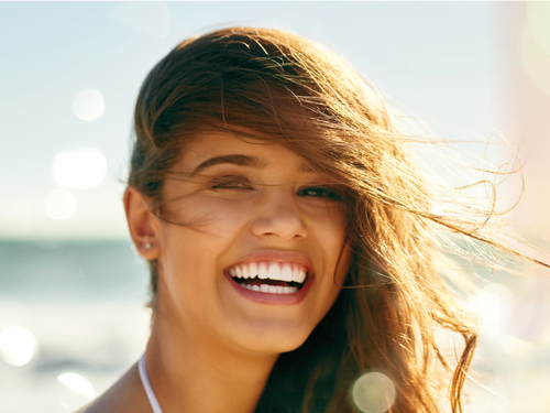 Smiling girl on beach